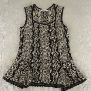 Cabi sleeveless sweater. Adorable peplum bottom.